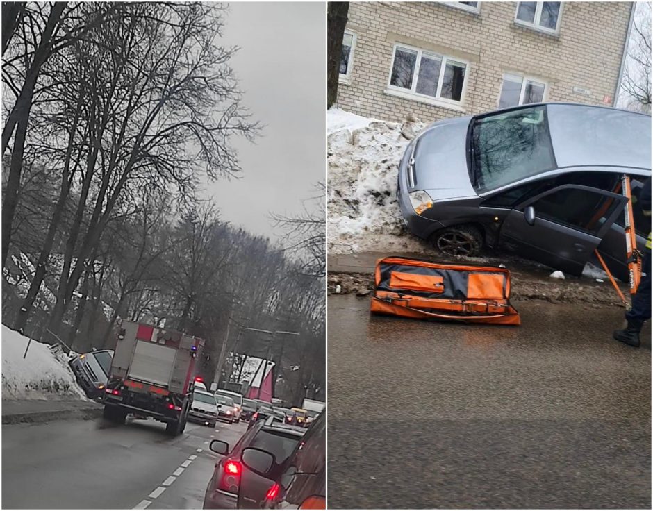 Po avarijos Vilniuje automobilis pakibo ant šlaito